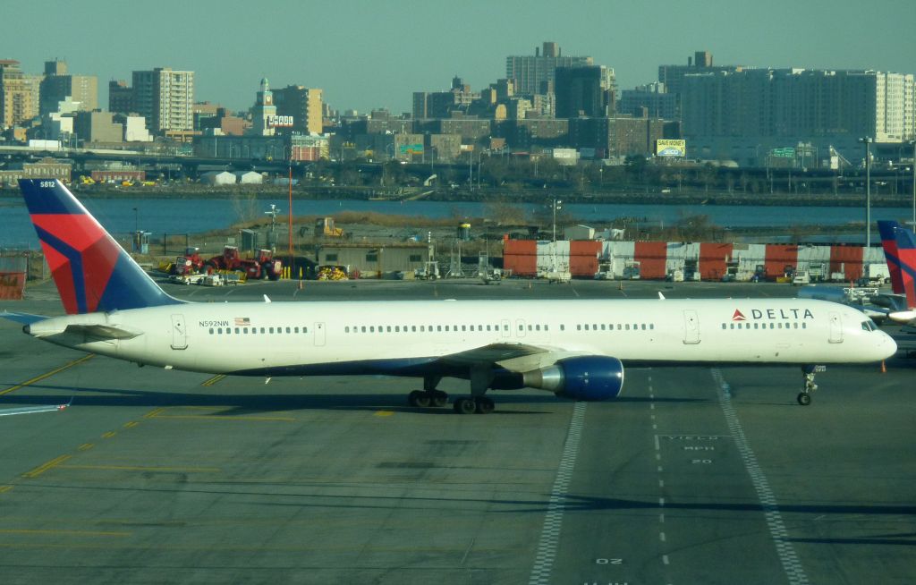 BOEING 757-300 (N592NW) - Very rare LGA visitor N592NW taxis to the gate on Feb 6. 2012. This 753 is operating Delta 1635, one of numerous extra flights bringing VERY HAPPY New York Giants fans home from the Super Bowl in Indianapolis.