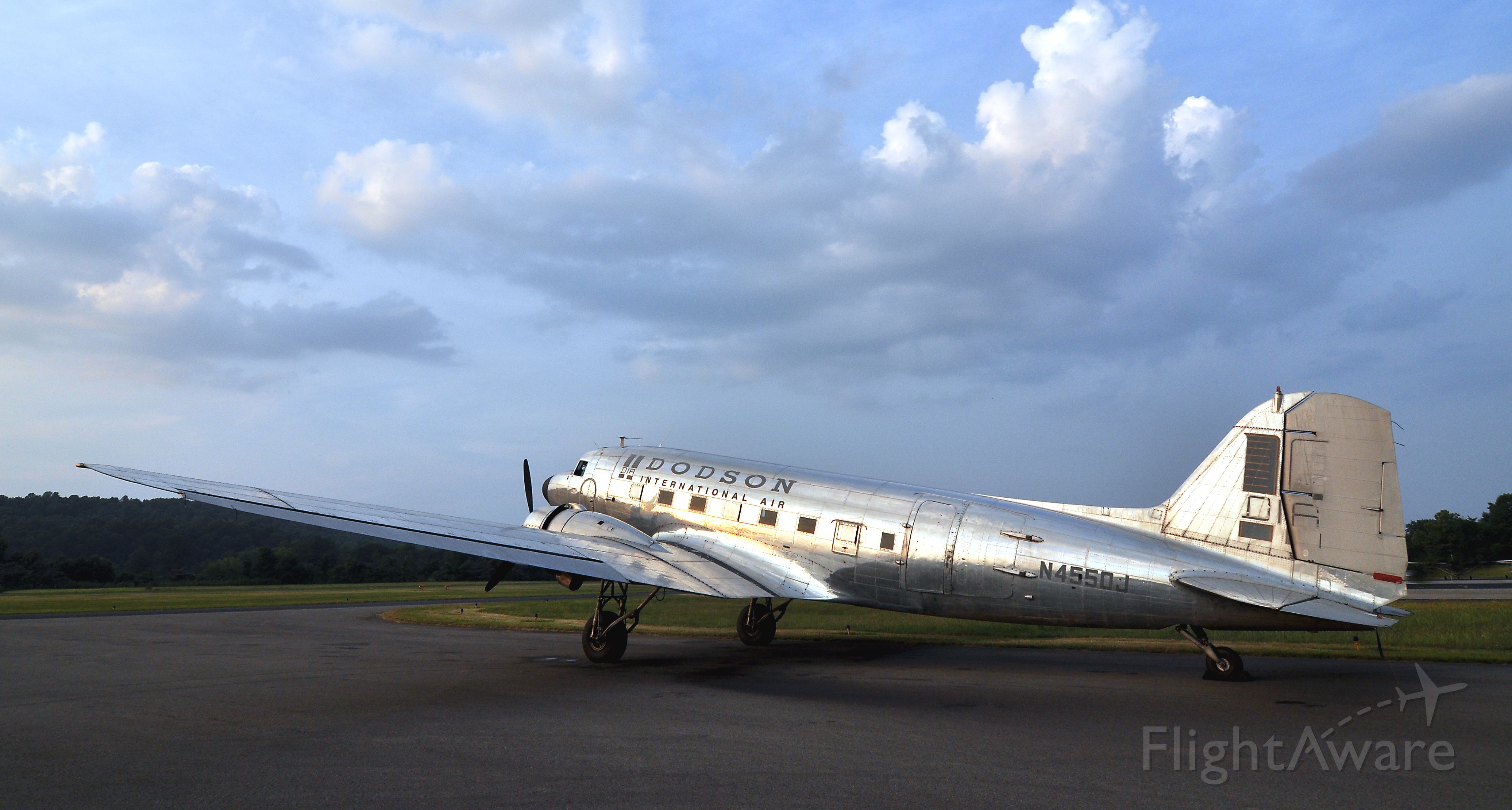 Douglas DC-3 (N4550J) - Late evening sunlight reflecting from the plane, and a pretty sky, made me stop and take several photos of it.  This is on the DKX ramp near the fuel pumps.