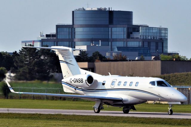 Embraer Phenom 300 (TOR803) - C-GNSB, an Embraer Phenom 300, departing off runway 33 at CYKZ. 