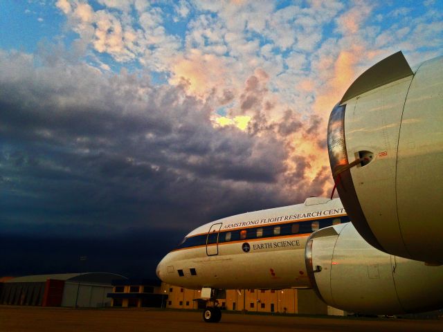 McDonnell Douglas DC-8-70 (NASA817) - NASA 817, DC-8, sitting on Salina ramp with a thunder storm cell approaching from behind. Nicholas Evenson Photography