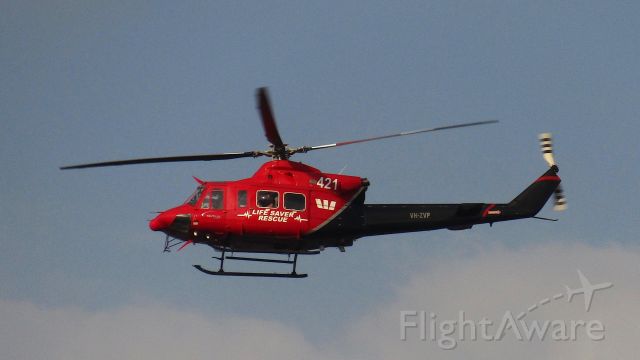 Bell 412 (VH-ZVP) - Over the Cairns harbour.