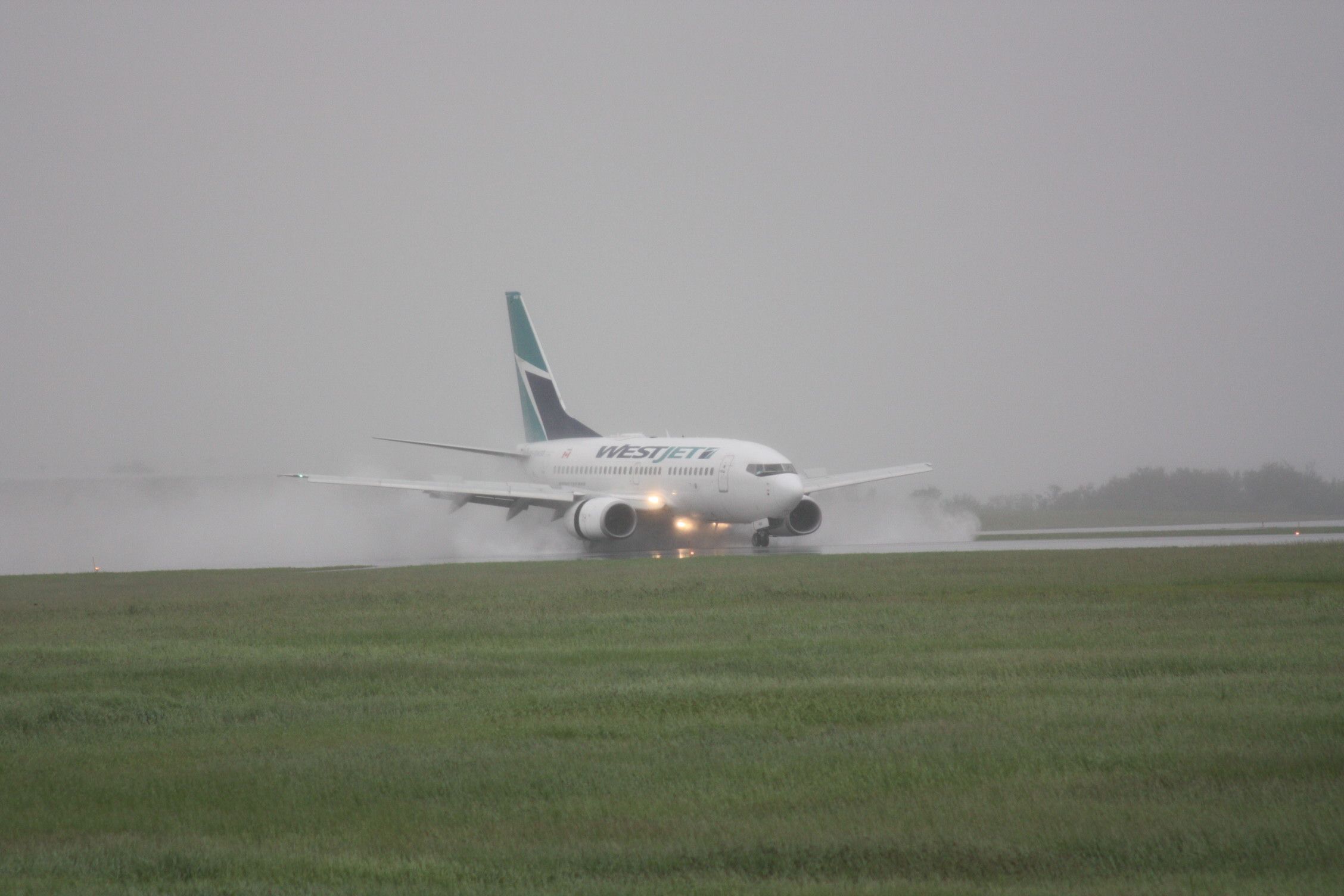 BOEING 737-600 (C-GWSB) - wet landing