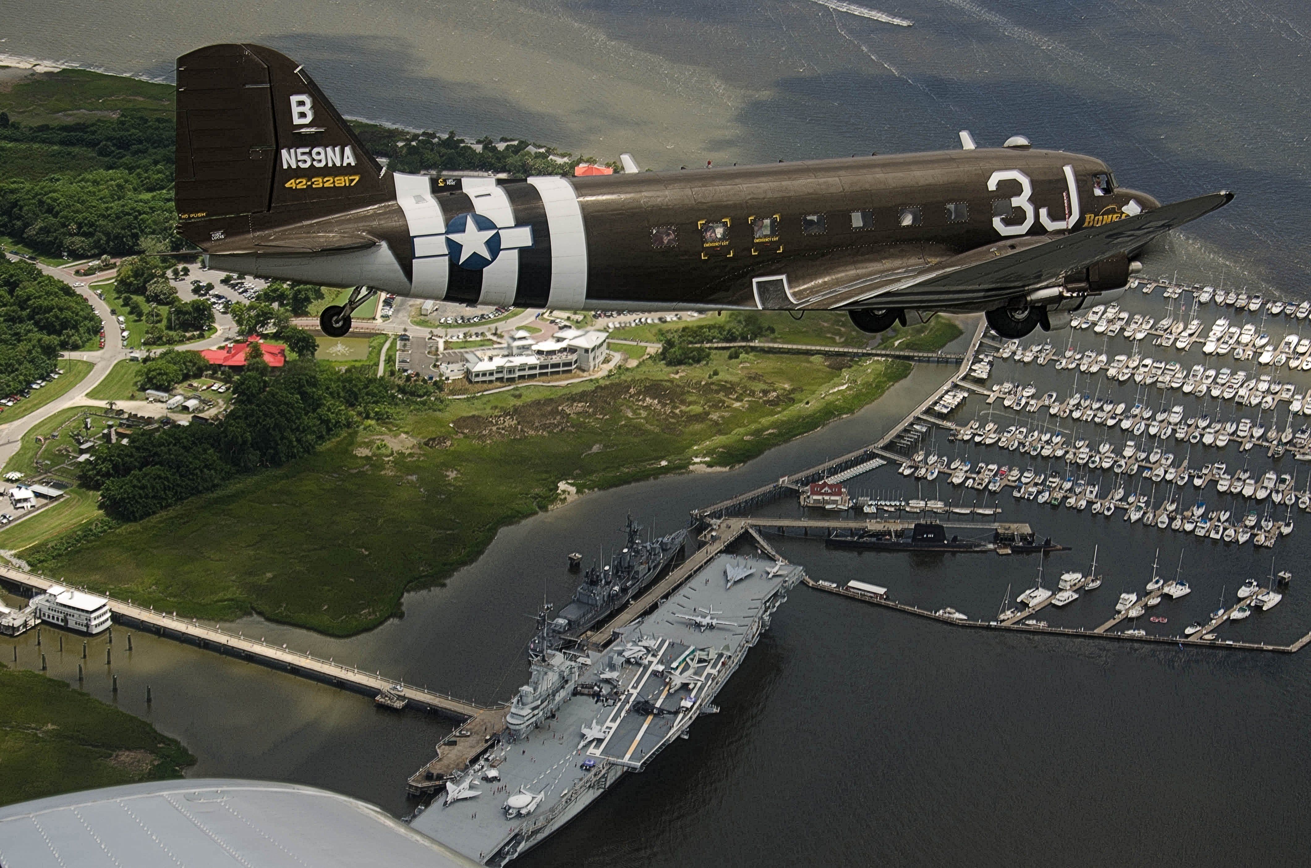 Douglas DC-3 (N59NA) - Taken from North American SNJ-6 Texan during South Carolina Salute From the Shore IV, 04 July 2013.  Over Patriots Point Maritime Museum, Charleston, SC - USS Yorktown (CV-10), USS Laffey (DD-724), and USS Clamagore (SS-343).