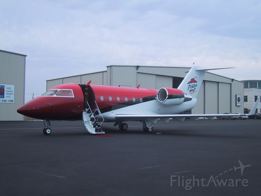 — — - Pizza Hut corporate jet parked at "Gate One" (now Atlantic Aviation)