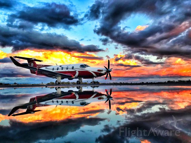 Pilatus PC-12 (N142LT) - Sunset after a rain storm passed