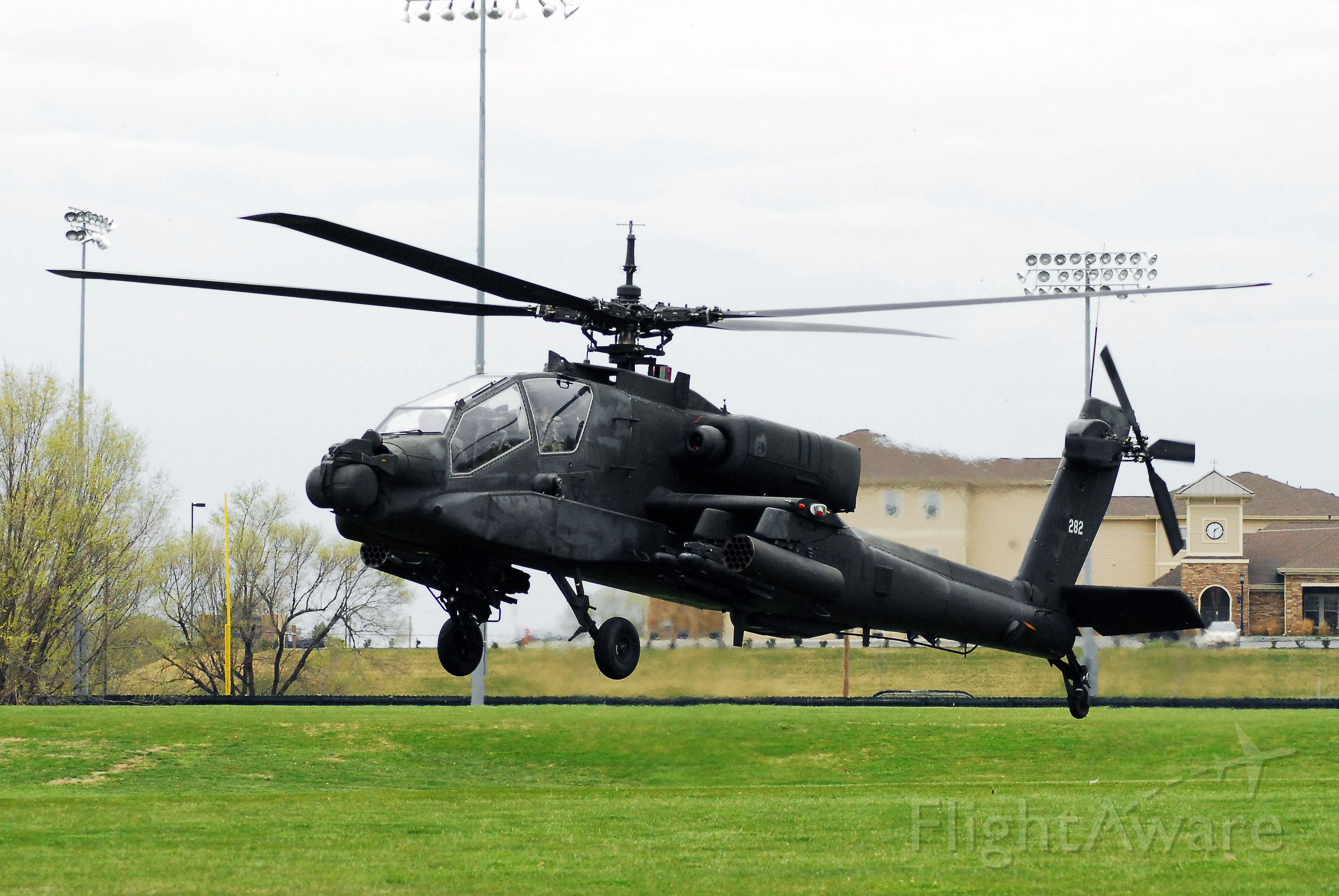 — — - AH-64 landing at the University of Central Missouri.