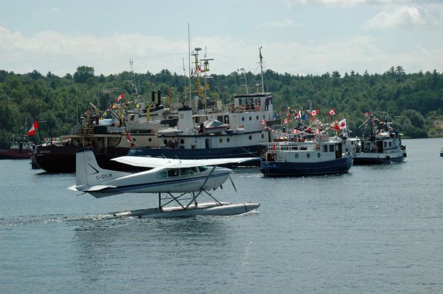 Cessna Commuter (C-GYLN) - 1977 Cessna 180K Skywagon (180-52794) departing from Parry Sound Harbour Water Aerodrome (CPS1) during Tugfest on August 27, 2011
