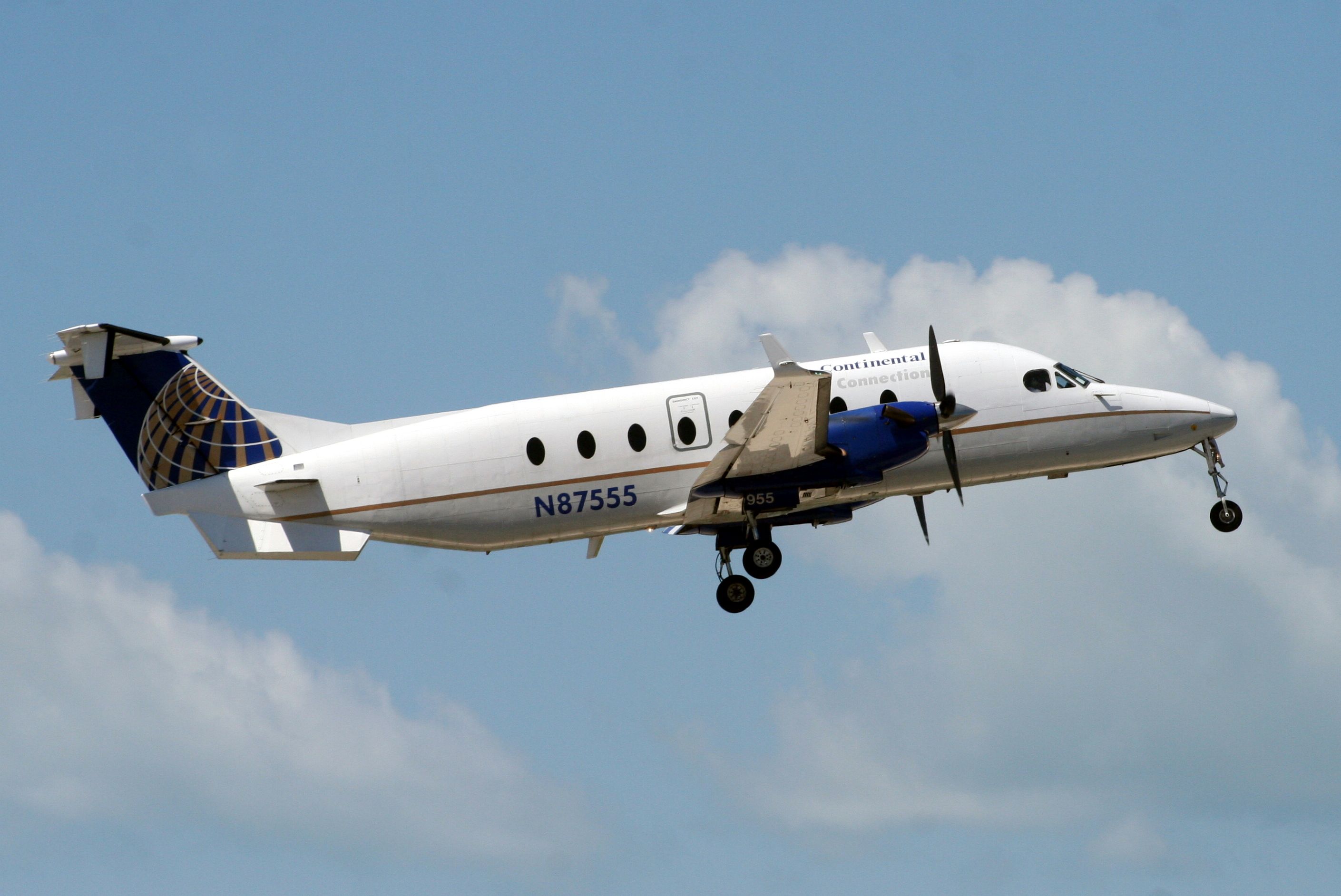 Beechcraft 1900 (N87555) - Airborne off rwy 8 operating flight GFT9194 to KTPA on 09-Apr-11.