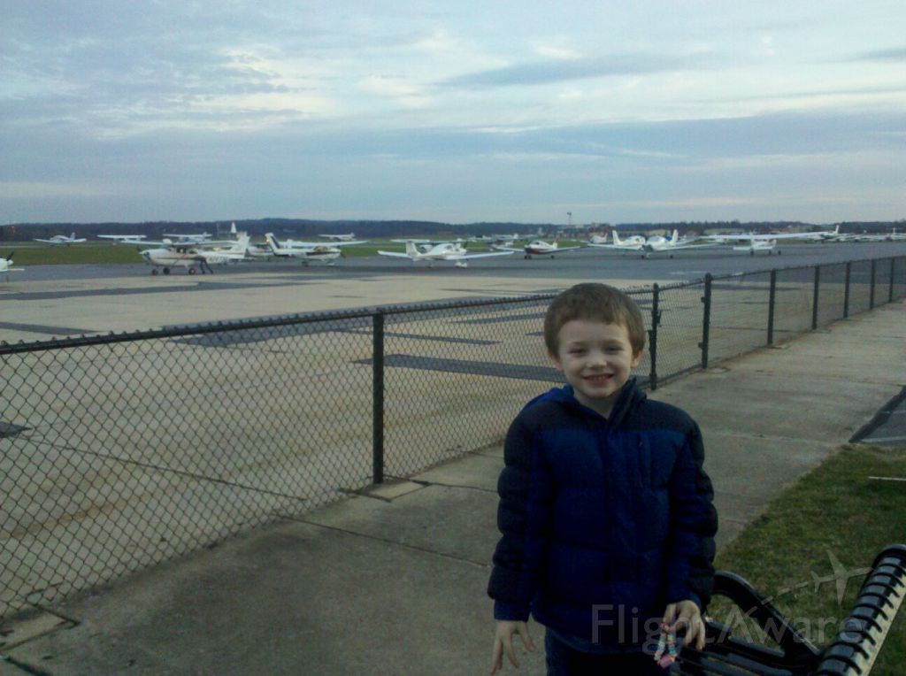 — — - My son posing for a picture with the various GA aircraft at Frederick Municipal Airport (KFDK).
