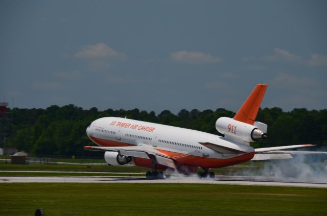 McDonnell Douglas DC-10 (N17085) - Tanker 911 smokes the mains while landing on Rnwy 20 at CHA on 5/10/17.  It was returning from dropping fire retardant on a wildfire at the Florida/Georgia border.  I was standing just outside the fence adjacent to the end of the runway.