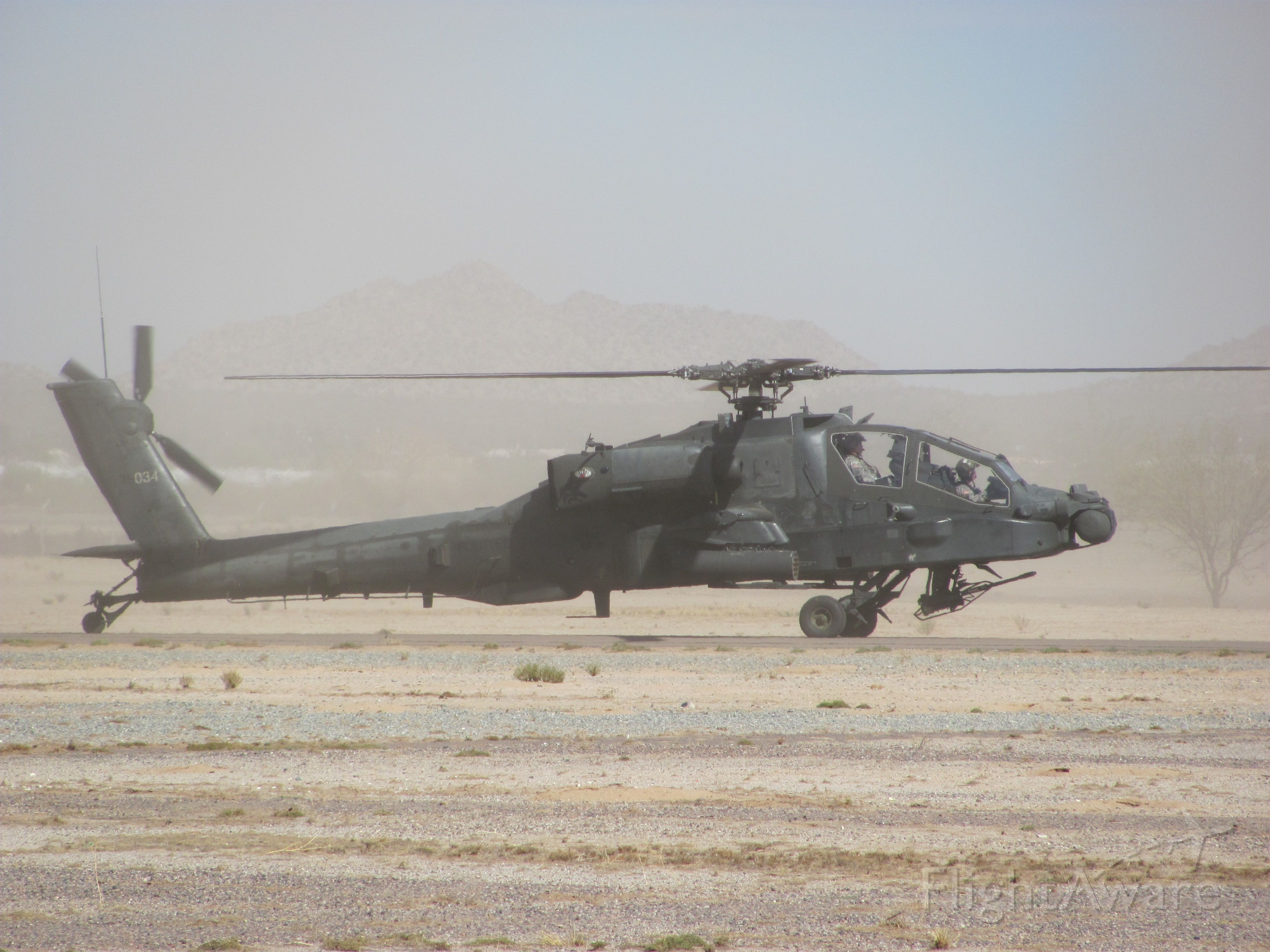 — — - An AH-64 attack helicopter landing at the 2009 Copperstate Airshow in Casa Grande, Arizona
