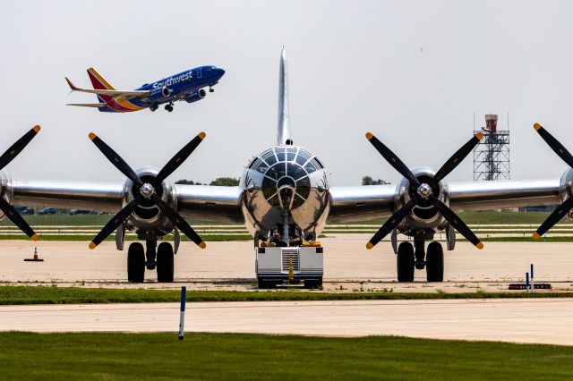 Boeing B-29 Superfortress (46-9972) - A Southwest 737 departs KGRR with Doc, a B29 Superfortress, in the foreground