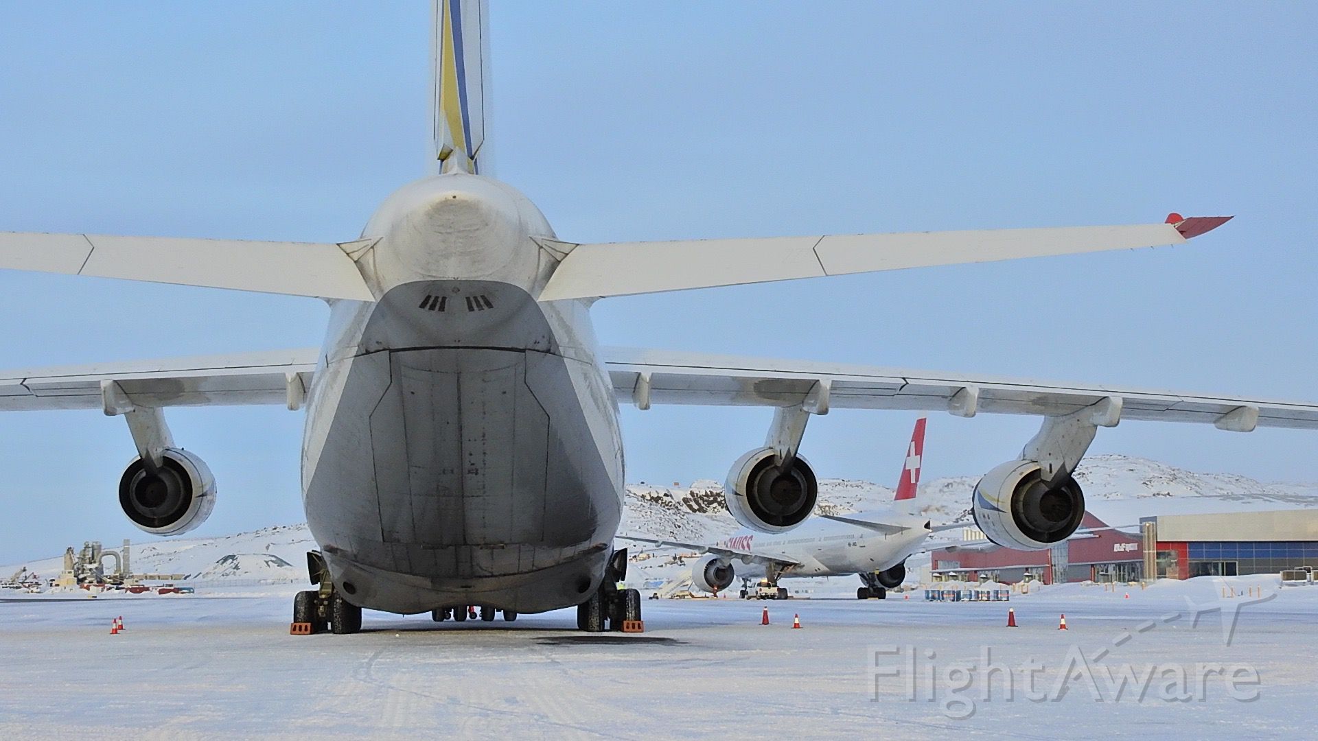 — — - Antonov AN124 and Swiss LX40 on the apron in Iqaluit Nunavut