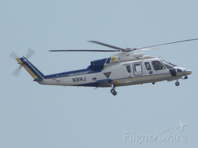 N8NJ — - N8NJ circling near KBLM looking for an armed suspect. Not exactly sure what he did, though.
