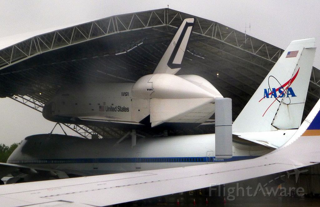 — — - Space Shuttle Enterprise arriving at JFK before its final delivery on the USS Intrepid Museum