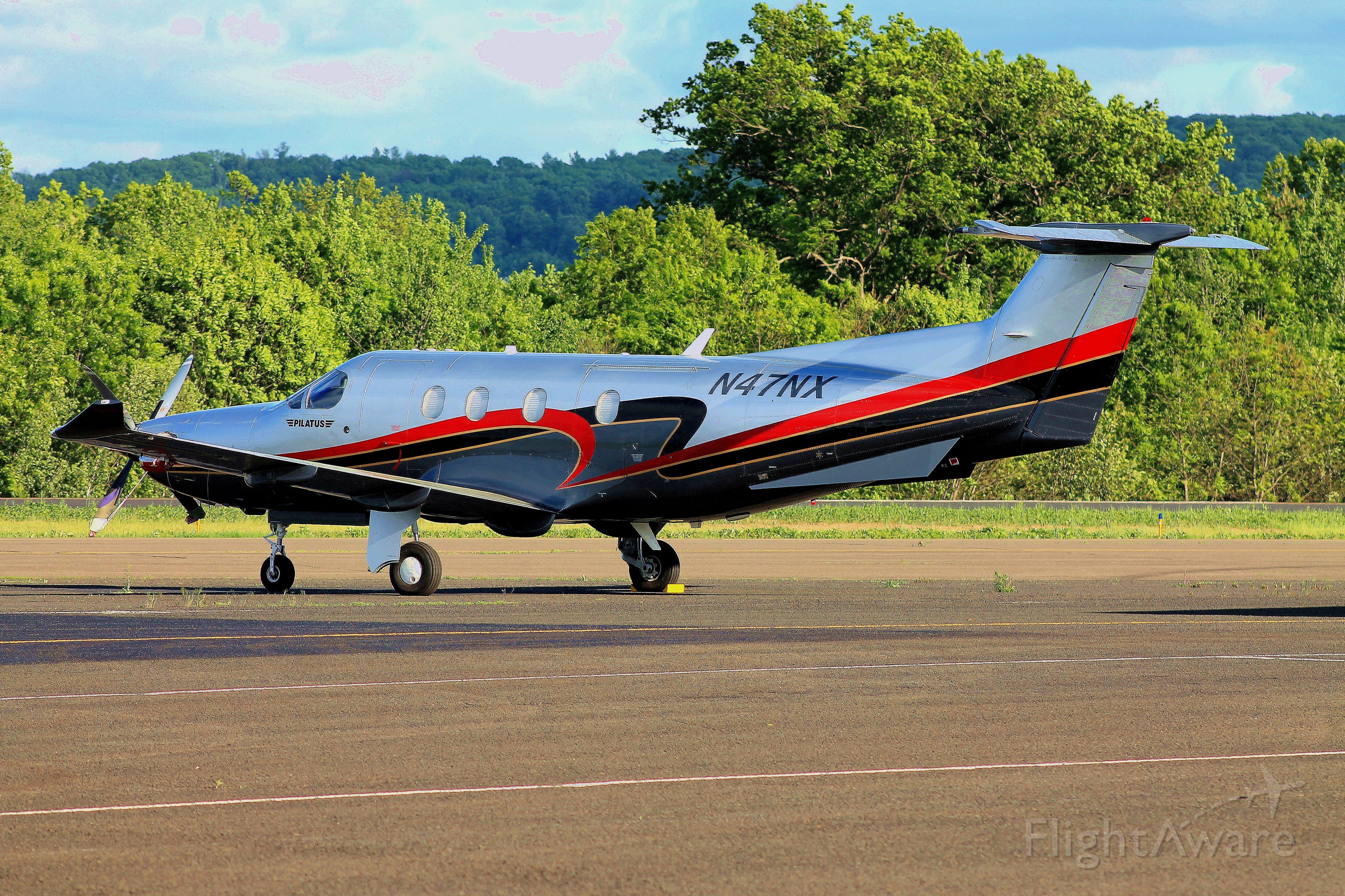 Pilatus PC-12 (N47NX) - Pilatus N47NX parked outside its hangar on a chilly spring evening, prepared for its morning flight to California the next day. Photo taken on May 26, 2013.