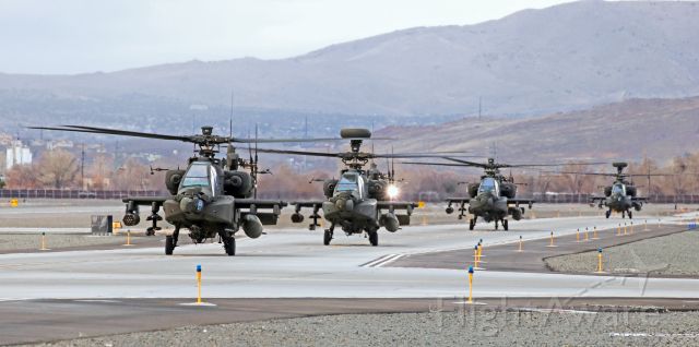 Boeing Longbow Apache (1109024) - Four US Army AH-64 Apache helicopters, with 1109024 in the lead and two Longbows in the group, are captured here just after they have landed on Charlie taxiway and are approaching the Atlantic Aviation ramp at Reno Tahoe International. A total of sixteen Army helicopters (eight Apaches and eight Black Hawks) arrived at RNO yesterday for an overnight stay.