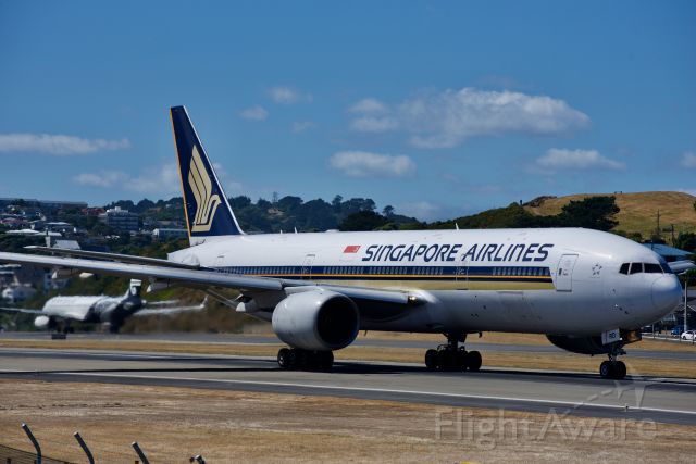 Boeing 777-200 (9V-SRO) - SQ248 starting it's takeoff roll on runway 16 at Wellington International before heading North to Melbourne. 