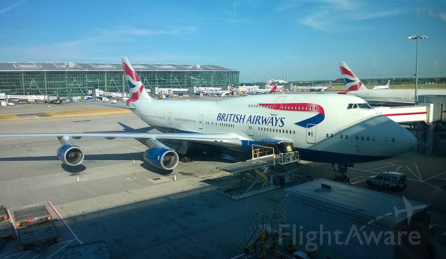 Boeing 747-400 (G-BYGG) - 15-8-2016 British Airways B747-400 G-BYGG completes final loading at London Heathrow Terminal 5B in the early morning summer sunshine before departure as BA53 to Seattle Tacoma.br /The loading operator can be seen closing the cargo door.br /The vast size of the 747 never fails to impress especially when you get up close.