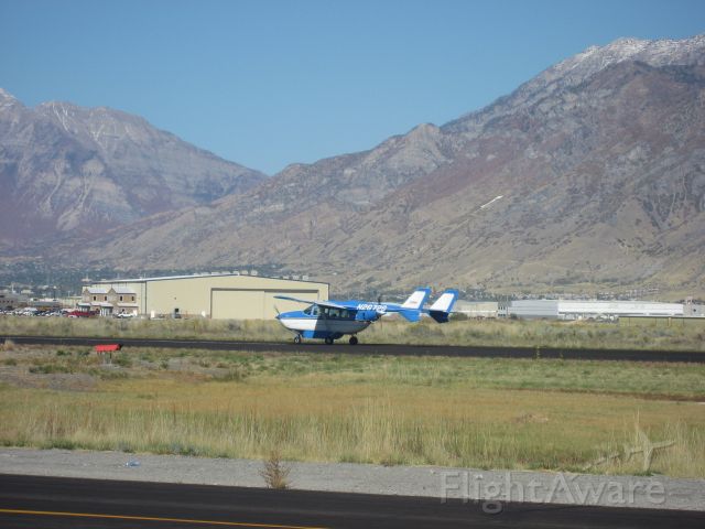 Cessna Super Skymaster (N2672S) - Landing with Spectrums Jet production facility in the Background at the Spanish Fork/Springville, Utah Airport.