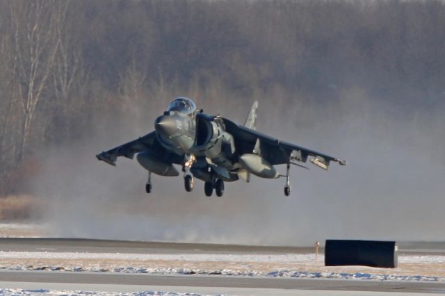 Boeing Harrier (16-5587) - Kicking up the snow during the Vertical/Short Takeoff from RWY 25 on 18 Jan 2018.