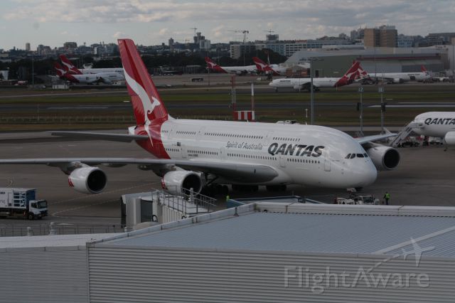 Airbus A380-800 (VH-OQJ) - Photo taken from International Terminal Observation Deck with the Qantas Jet base in the background.