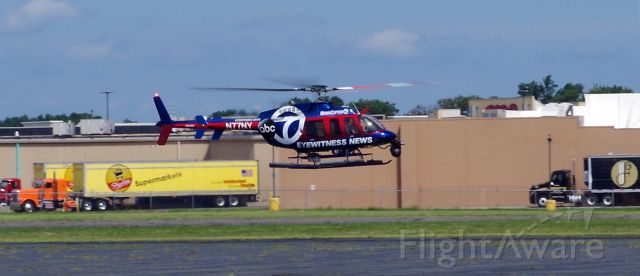 Bell 407 (N77NY) - LINDEN AIRPORT-LINDEN, NEW JERSEY, USA-AUGUST 21, 2020: A news helicopter from one of the local New York City television stations is seen preparing to take off on Runway 27 after refueling.