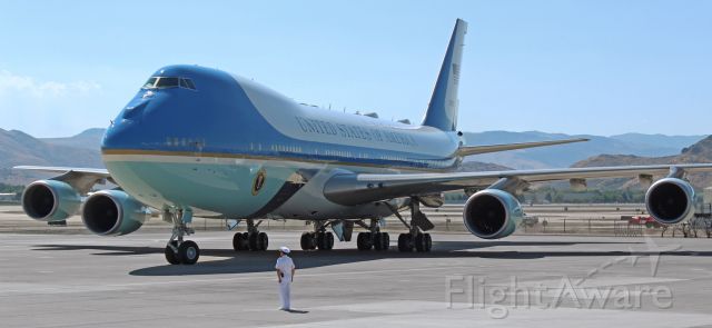 Boeing 747-200 (92-9000) - A United States Navy SEAL officer stands at attention and prepares to salute as Air Force One (92-9000) turns to pass in front of him and park on the Nevada Air Guard ramp.