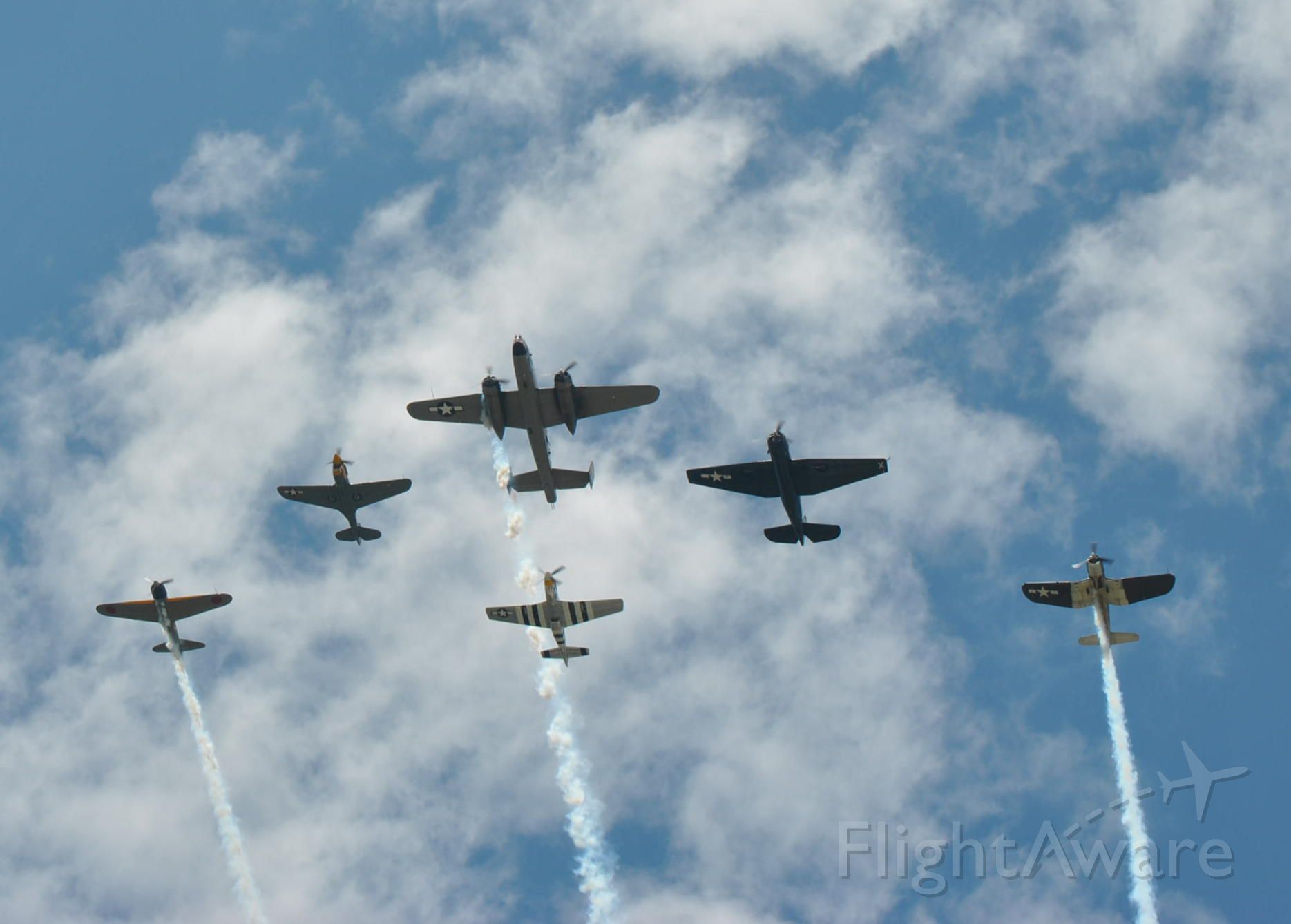 — — - A formation at Sun N Fun:  A6N Zero (not a replica), P-40 Warhawk, B-25 Mitchell, P-51 Mustang, TBF Avenger, F4-U Corsair