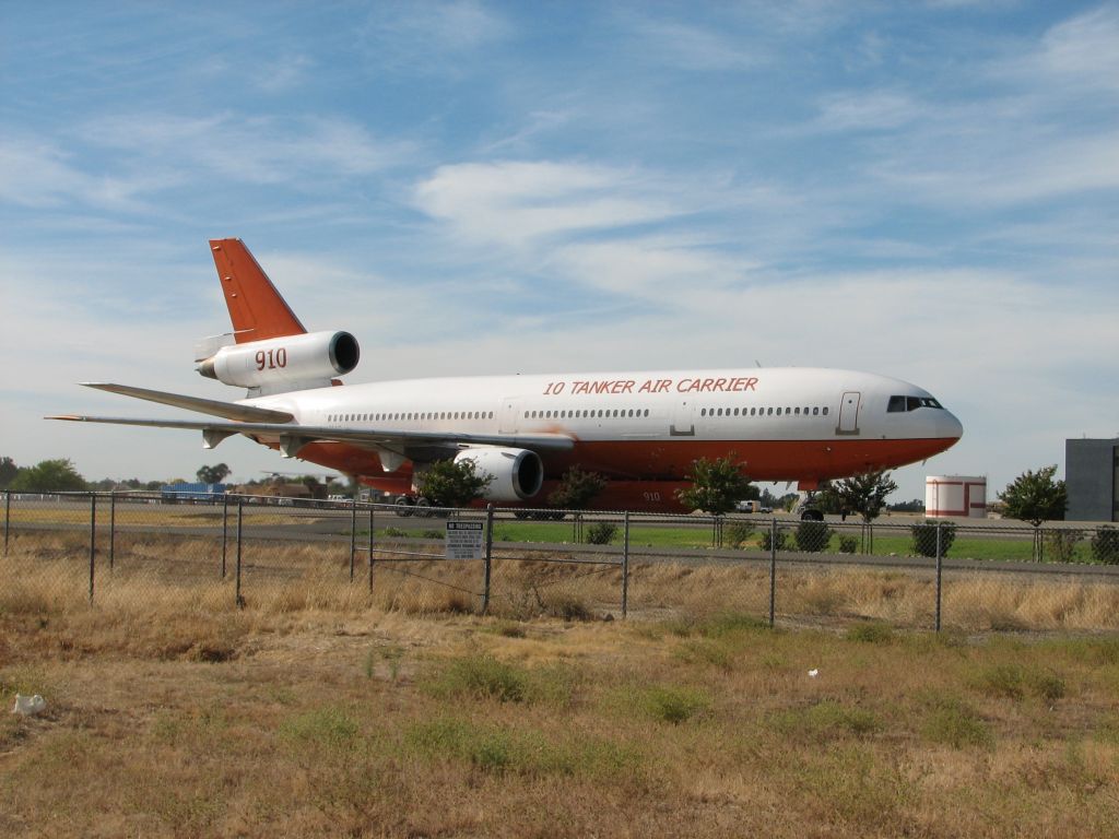 McDonnell Douglas DC-10 (N450AX) - Tanker 910 back from the Rim fire for another load.  Waiting for Tanker 911 to leave.