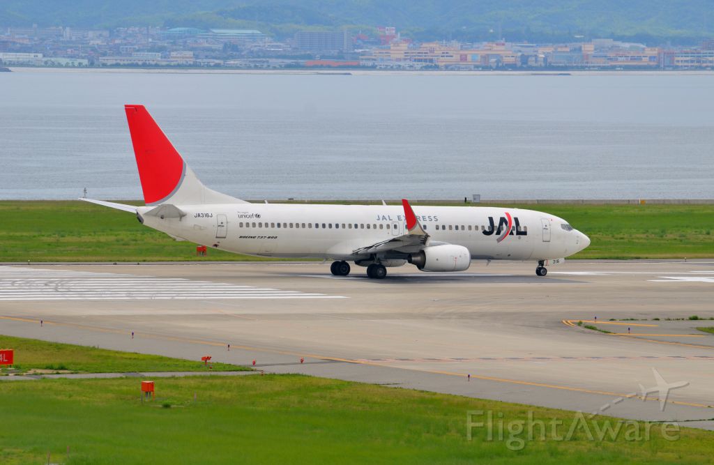 Boeing 737-800 (JA316J) - Airline: Japan Airlines (JL/JAL); Airport: Kansai International Airport (KIX/RJBB); Camera: Nikon D7000; Date: 4 July 2012