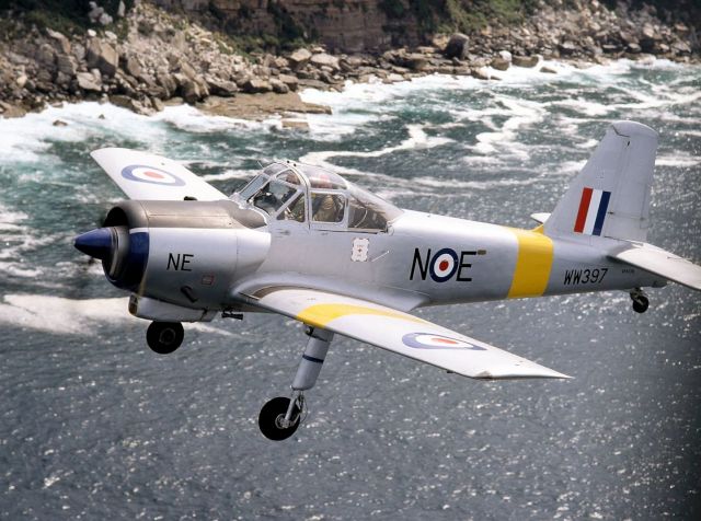 VH-OIL — - Beautiful coastal scenery behind restored Provost WW397 in air to air by Bob Livingstone 26 September 1994