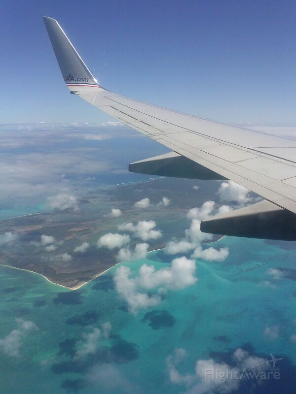 Boeing 737-800 — - Descending into V.C Bird Intl., passing Barbuda.