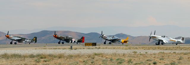 North American P-51 Mustang (N2869D) - Five Unlimited Class Racers are lined up awaiting permission to take off to compete at the 2022 Stihl National Championship Air Races (aka: Reno Air Races).br /br /The four that are visible are "Wee Willy II,' "Speedball Alice,' "Dolly," and "Bardahl Special" (N2869D). There is a fifth one behind "Bardahl Special" and although I am not 100% positive, I think it is "Pretty Polly,' a Bell P-63 Kingcobra.br /* Note: All of this year's Unlimited Class aircraft are wearing a special sticker which pays tribute and remembrance to Sherman "Sherm" Smoot. "Sherm," who was the Unlimited Class President and who was registered to participate in this year's event flying Race 86 ("Czech Mate"), was fatally injured last week when "Czech Mate" crashed in California. *br /Blue Skies and Tail Winds Forever, Sherm.