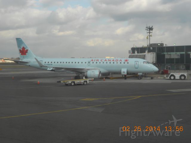 Embraer ERJ-190 (C-FMZW) - Air Canada E190 at gate A7 at Denver eventually departing to Toronto/Person.  Taken from the window of my flight.