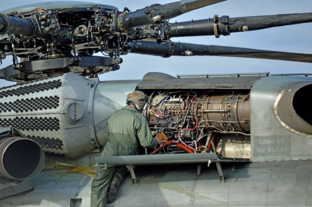 — — - A Marine Corps CH-53 Super Stallion from McGuire AFB sits at Niagara Falls International Airport being repaired. They did not have the right part to fix it so another super stallion was dispatched to deliver the part.