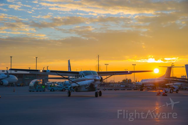 Cessna Caravan (N785WW) - This is a Westwind Aviation Cessna Caravan that is hauling cargo for UPS. The sunset was developing into a spectacle as it often does in Phoenix. The rampers saw this, and stood and watched as I shot images of this aircraft in front of this beautiful sunset. © Bo Ryan Photography | a rel=nofollow href=http://www.facebook.com/BoRyanPhotowww.facebook.com/BoRyanPhoto/a If you like my work, please vote!