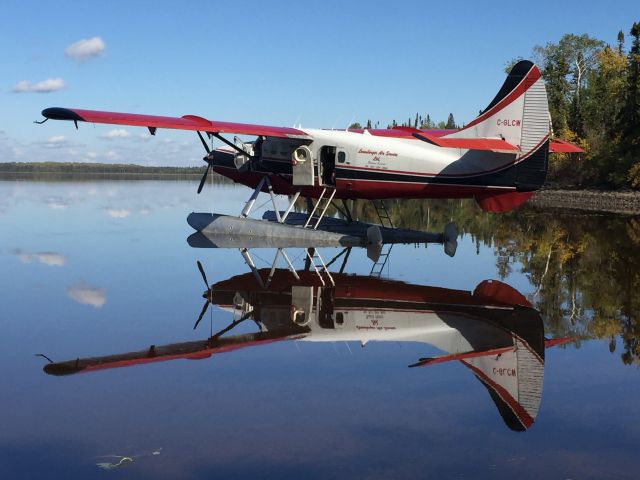 De Havilland Canada DHC-3 Otter (C-GLCW) - LCW (a Vietnam veteran of US Army 18th Aviation Co.) sits peacefully on the Albany River in Northern Ontario to pick up a load of moose hunters. 