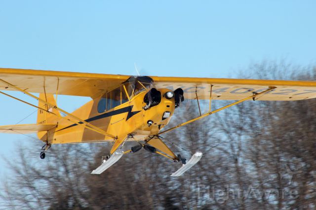 Piper NE Cub (N40827) - Piper Cub J-3 with classic paint scheme departs down the improvised flight line at Pioneer Airport Ski Plane Fly-In 2-22-20 
