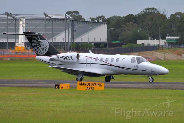 Cessna Citation CJ2+ (F-ONYY) - A rare visitor to Bankstown, taxying for a repositioning flight to Sydney International before escaping rain and heading back to New Caledonia. Feb 23, 2021.