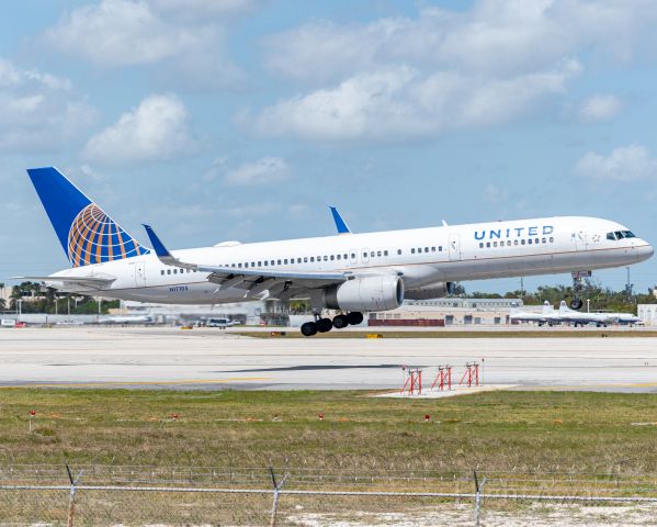 N17105 — - United Airlines Boeing 757-200 moments away from touching down on runway 12 at MIA
