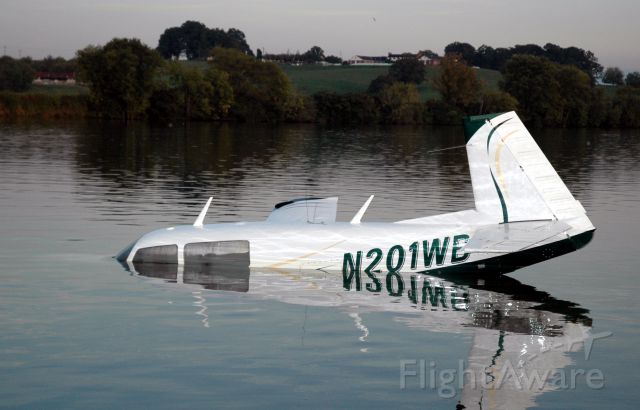 N201WC — - This Mooney skidded off the departure end of runway 8 at KDKX, and into the Tennessee River.