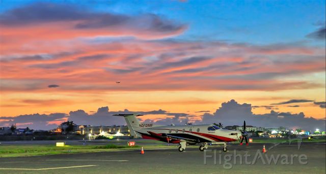 Pilatus PC-12 (N212MF) - Pilatus 12 N212MF resting at TNCM St Maarten for the evening in a Caribbean sunset.