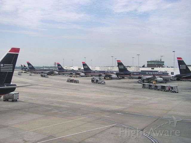 Airbus A319 (N701UW) - Nice mix of Airbus & Boeing aircraft on USAirways CLT B Concourse back in June 2004 !