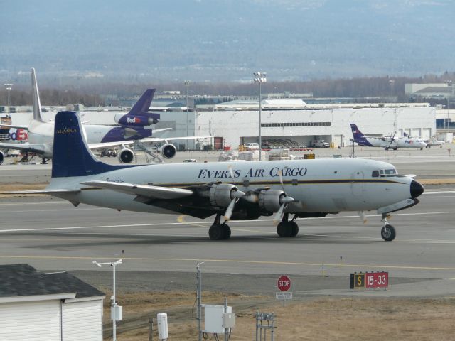 Douglas DC-6 (N351CE) - N351CE taxing at Anchorage for the afternoon run to Unalakleet, AK. on 04/24/2015
