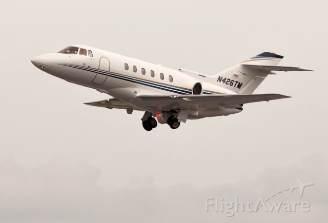 Raytheon Hawker 800 (N426TM) - Take off RW26. Nose gear retracts first in the up cycle.