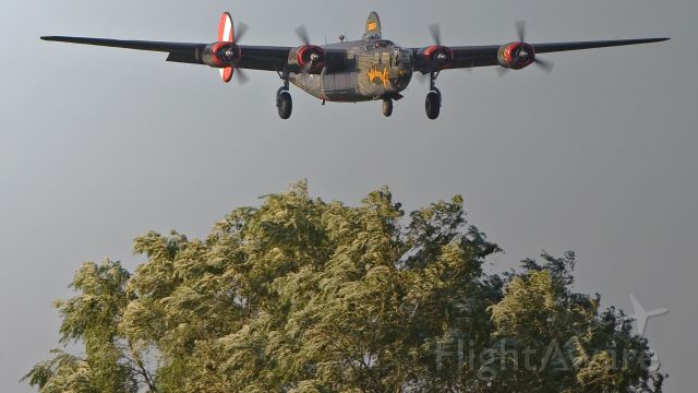 Avro 683 Lancaster (25-2534) - Over the trees into Cape May County NJ,Runway 19