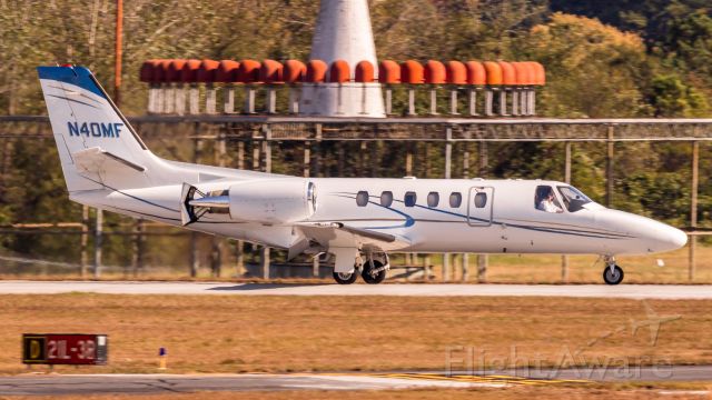 Cessna Citation II (N40MF) - From the spotting platform at PDK with my 400mm f/5.6L and Canon SL1. 