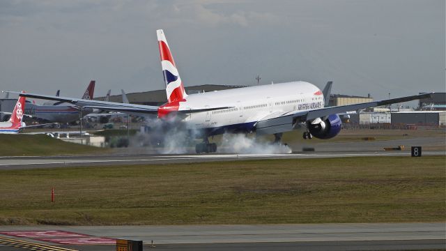BOEING 777-300 (G-STBJ) - BOE76 makes tire smoke on landing Rwy 16R to complete its maiden flight on 2/26/14. (LN:1182 cn 43703).