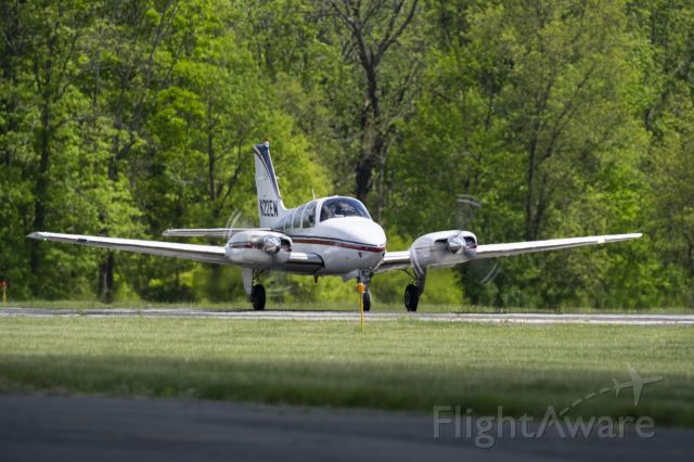 Beechcraft 55 Baron (N22EW) - Shot 5/14/21 from along taxiway as plane was taking off